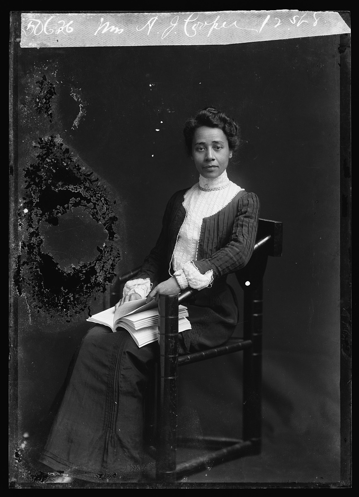 black and white phot of Anna Julia Cooper, a black woman sitting in a victorian dress