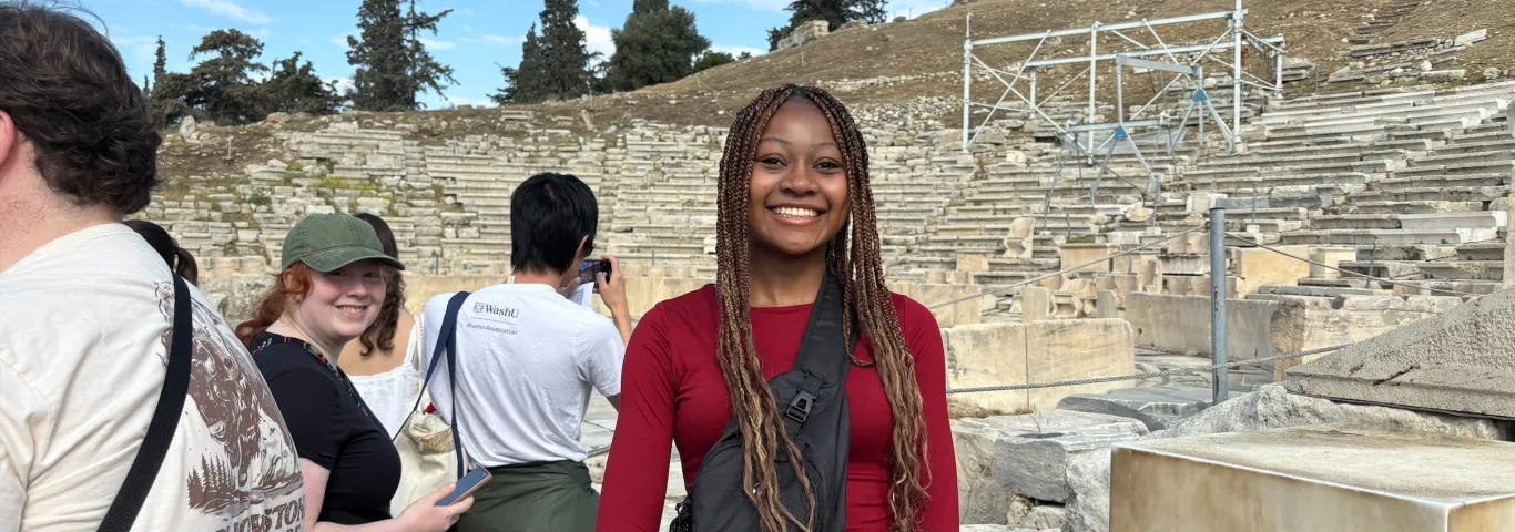 Student standing in a Greek Amphitheater 