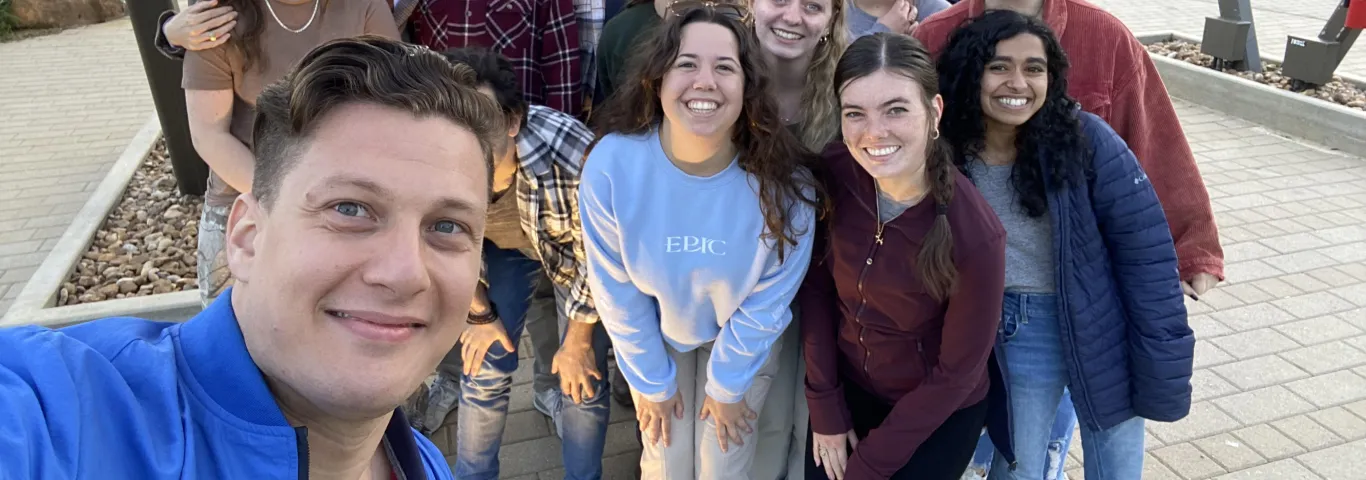Alumni with a group of students from a Classics Club