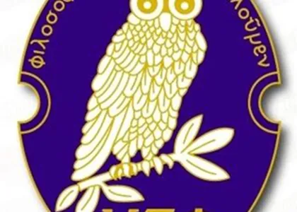 a blue lapel pin depicting an owl perched on a  branch