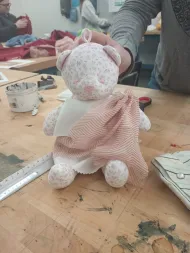 stuffed bear wearing traditional greek clothing