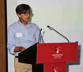 Aravecchia speaking at Macquarie University