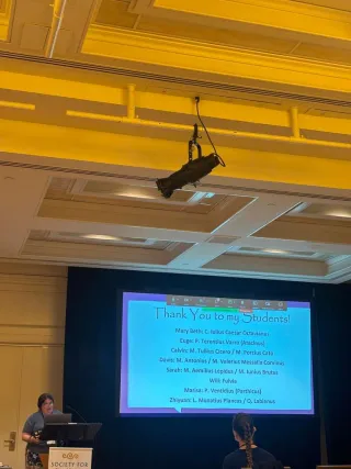 Sears with slide thanking her students