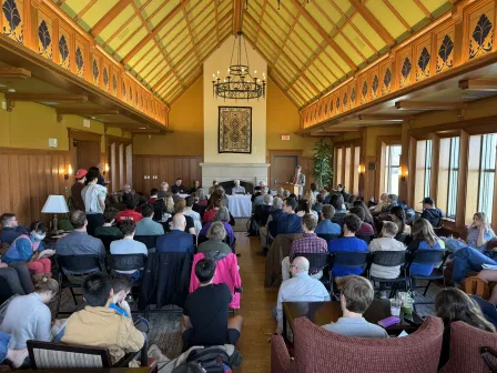 historian panel in front of crowd in Goldberg Formal Lounge