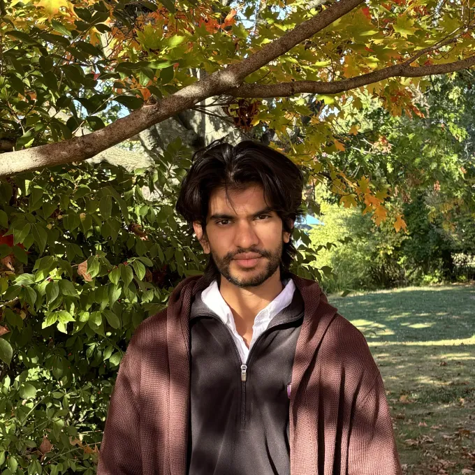 Vedul Palavajjhala under autumn foliage