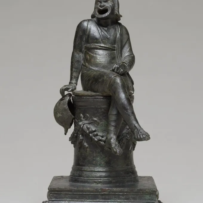 statue of Roman masked character