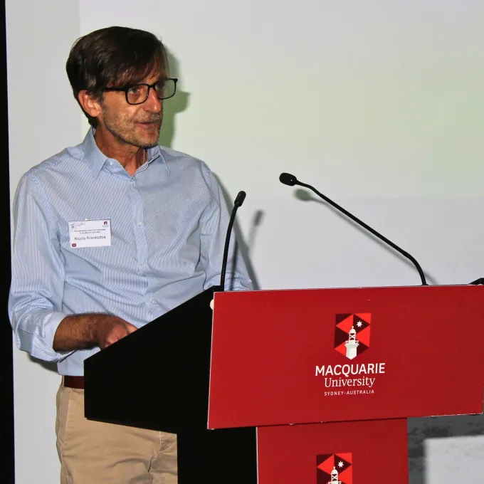 Aravecchia speaking at Macquarie University