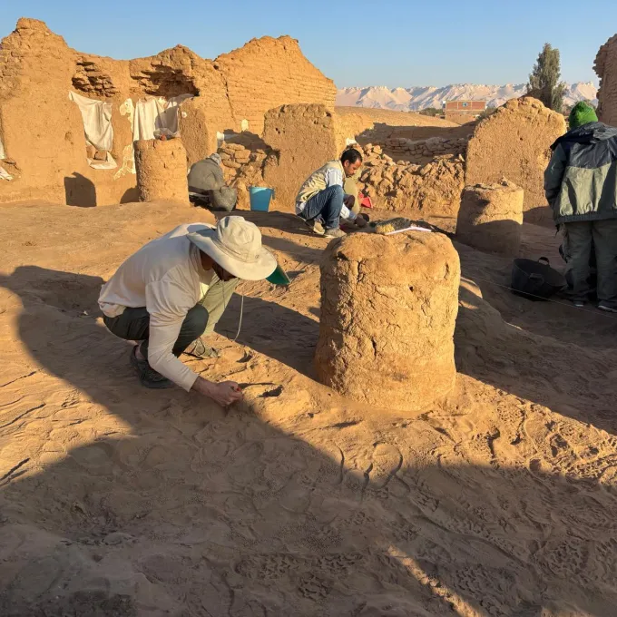 Held Cleaning a post-abandonment feature in Room 7 of building B10 prior to photographing it.  