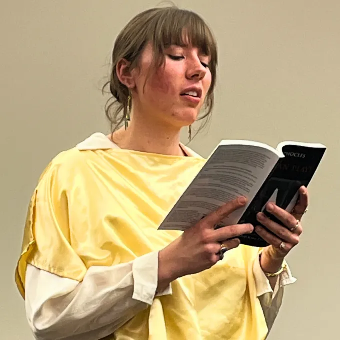 Undergrad student, Hannah, reading from Antigone